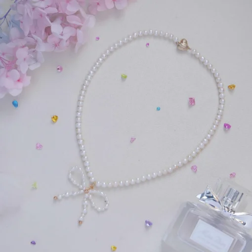 Charming Round Pearl Necklace with Delicate Bow Pendant